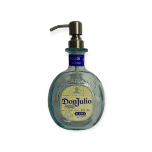 Don Julio Dispenser is made in a traditional tequila-round small bottle with aquamarine glass. The label is silver and cream with navy writing. The pump is silver.