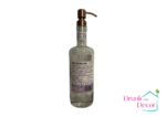 The Mistral Dispenser is transparent with a floral purple and pink label, giving Provence vibes.